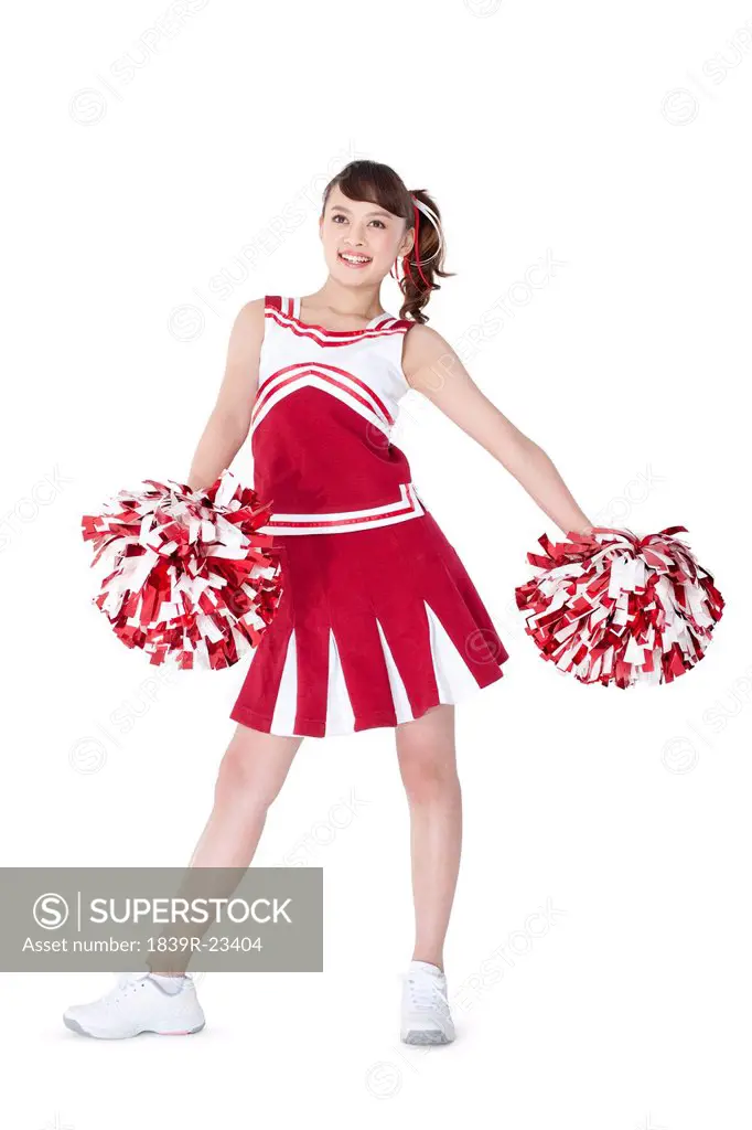 Cheerleader in action with her pom_poms