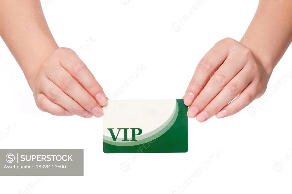 Woman Holding a VIP Card