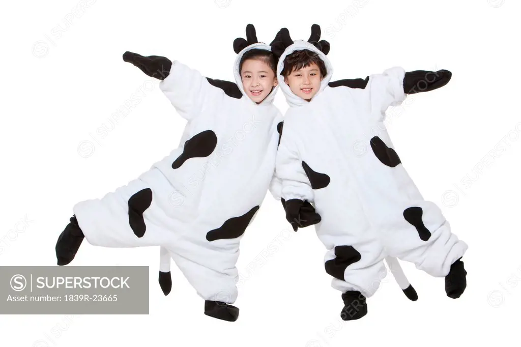 Children in cow costumes playing around