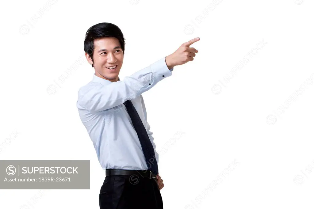 Portrait of an Excited Businessman Pointing