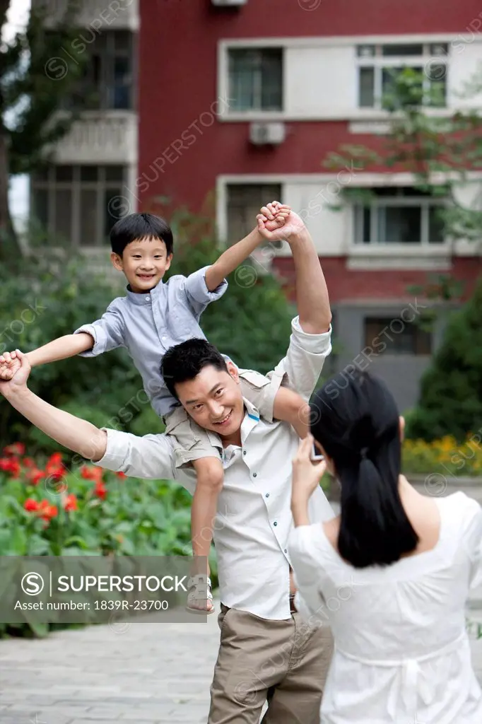 Young Chinese family taking pictures