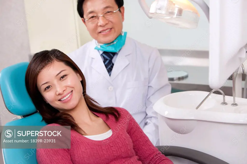 Dentist and patient in dental clinic