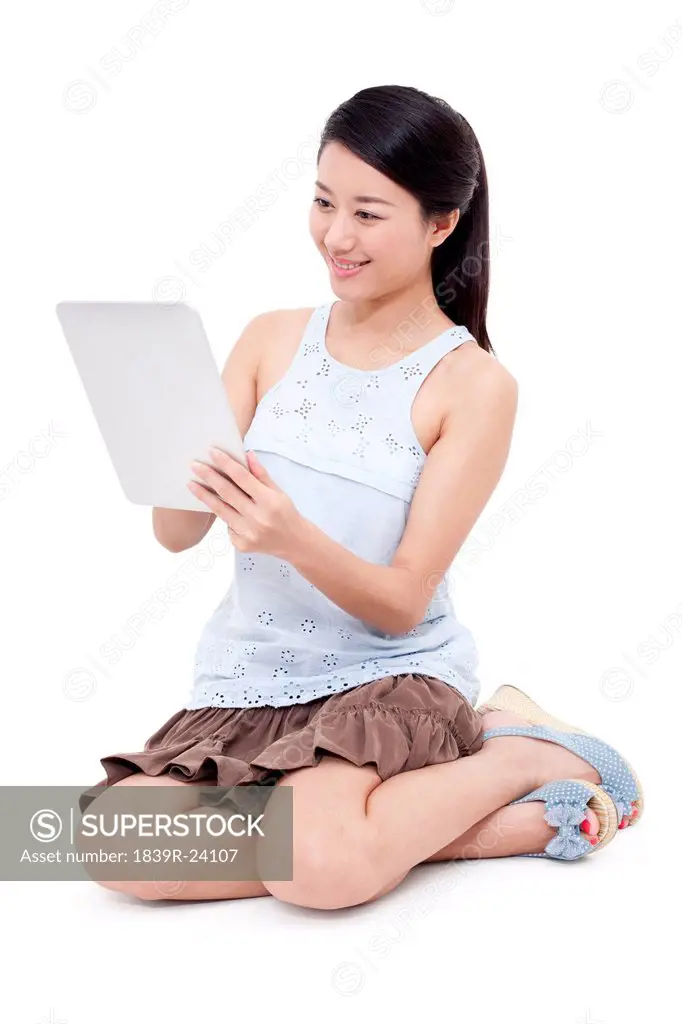 Happy young woman and digital tablet