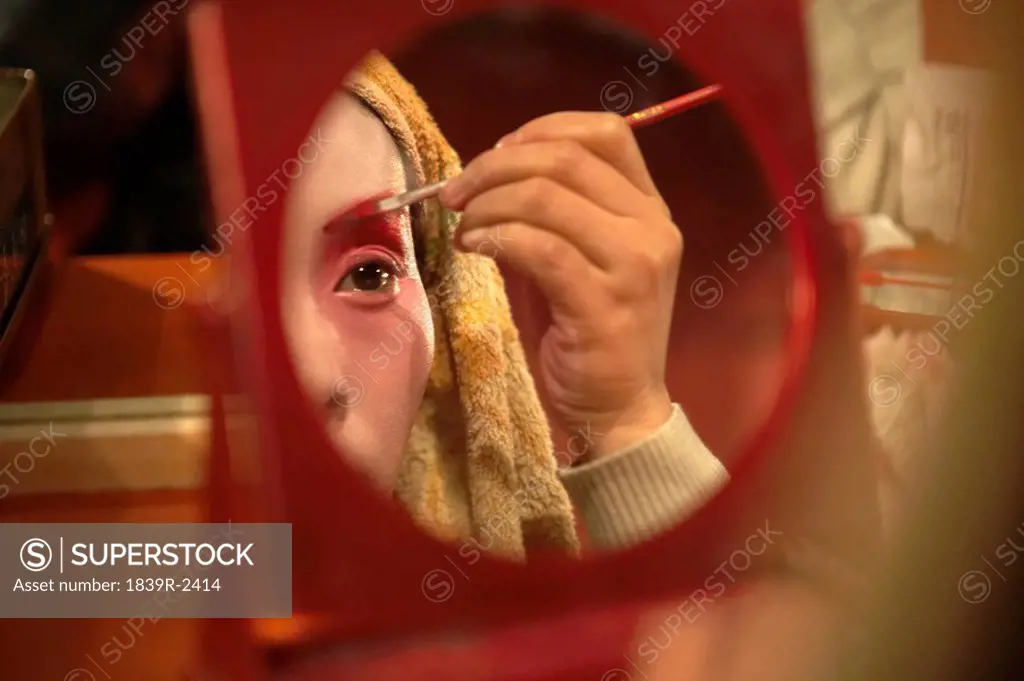 Woman Applying Make_Up With Brush