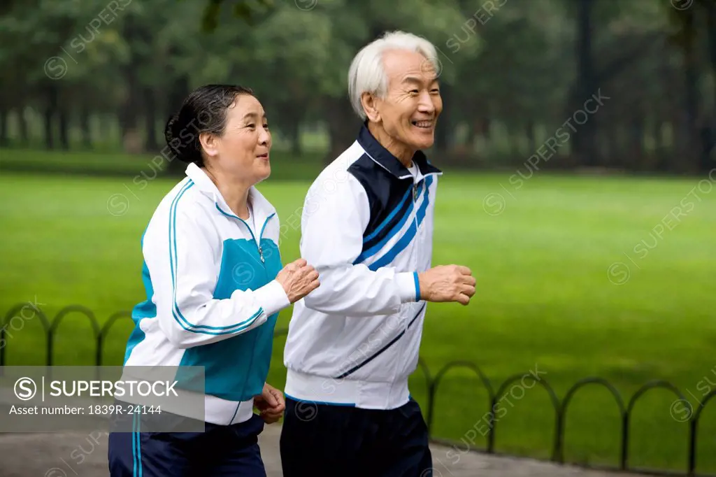 Senior Couple Jogging in a Park