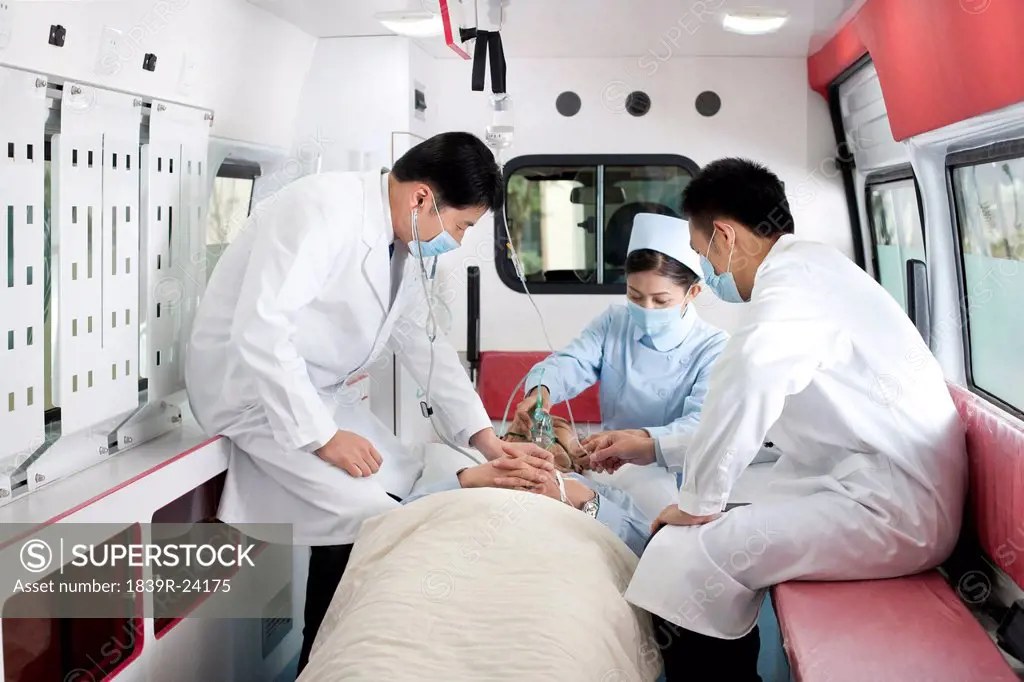 Medics treating a patient in an ambulance