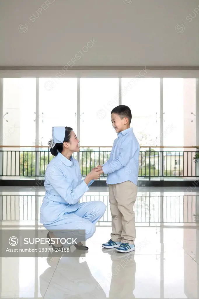 Nurse Talks to Young Boy