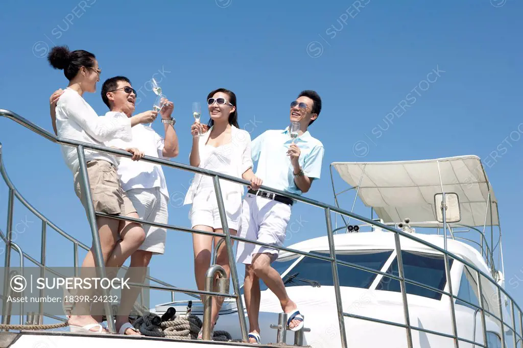 Friends Drinking Champagne on a Yacht
