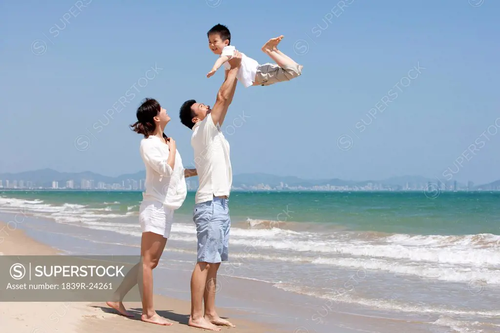 Family Playing at the Beach