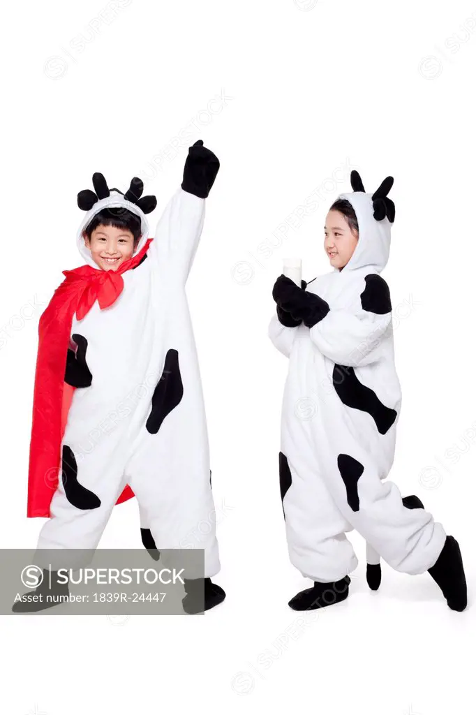 Boy and Girl Dressed in Cow Costumes