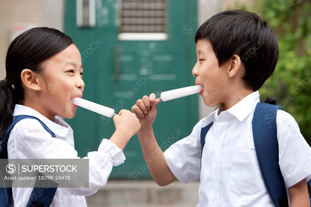 Happy children with popsicles