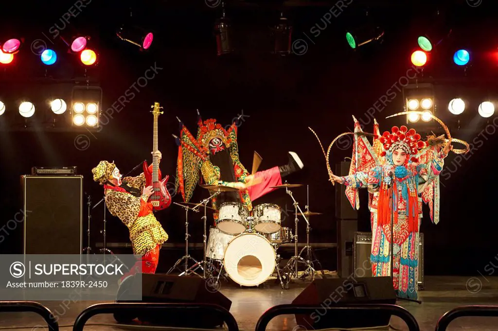 Band In Ceremonial Costume Playing Musical Instruments