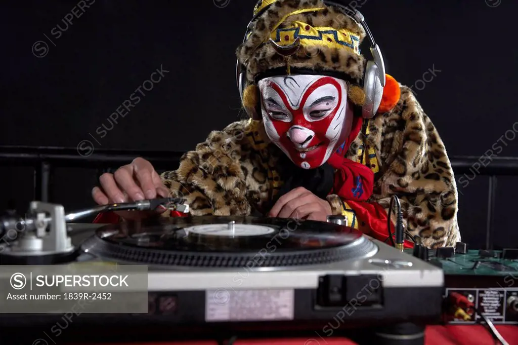 Man In Ceremonial Costume Using Turn_Tables