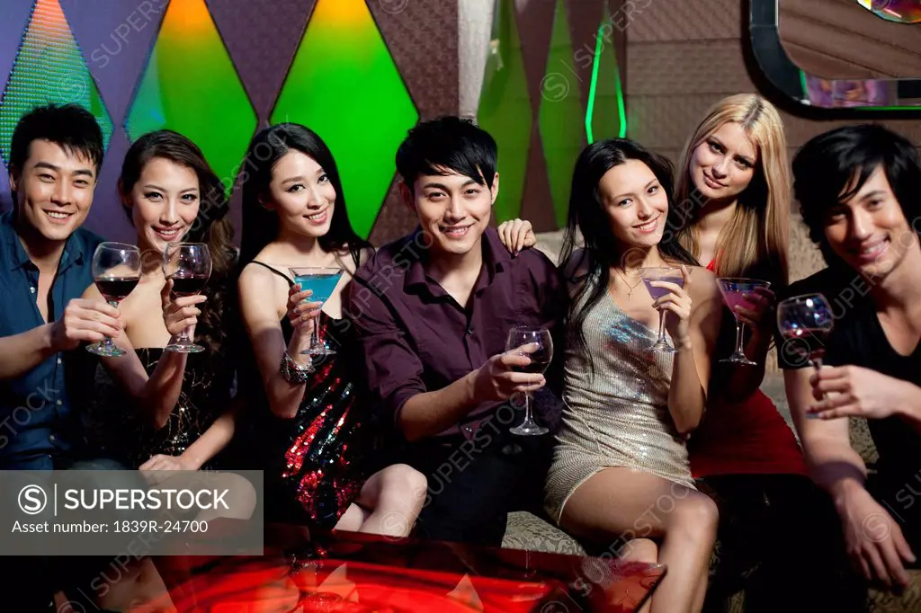 Stylish young people drinking in bar