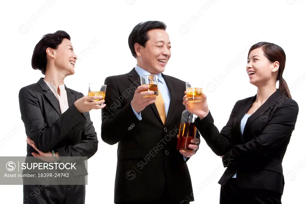 Business team enjoying whiskey