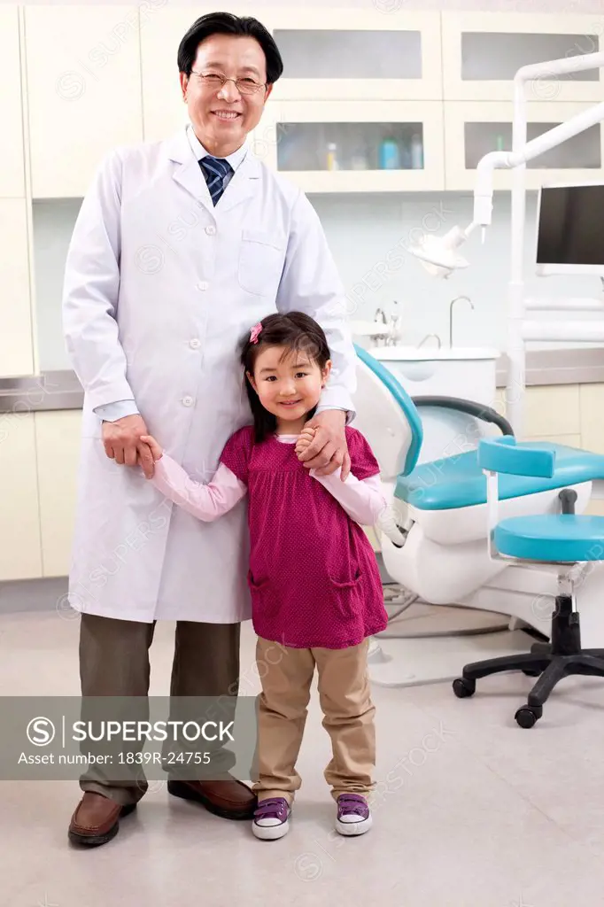 Dentist and little patient in dental clinic