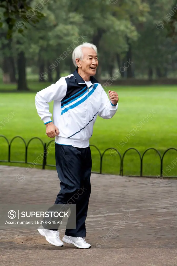 Senior Man Jogging in a Park
