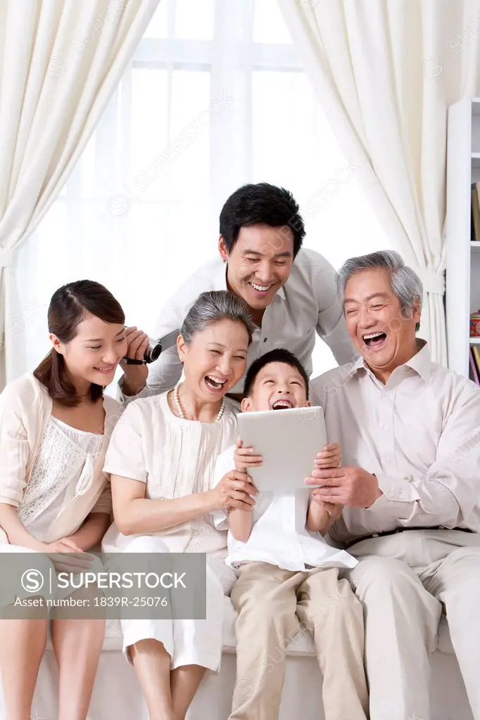 Happy Family Using an iPad together