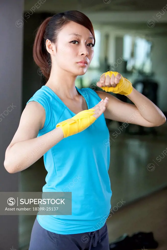 Confident Young Woman in Hand Wraps