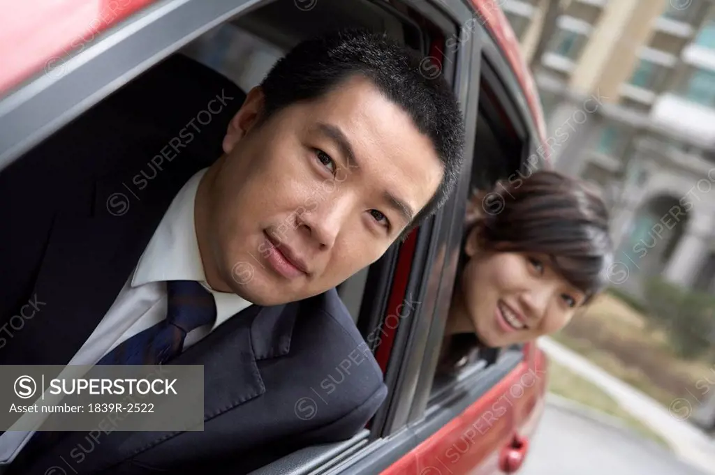 Businesspeople Sitting In Car