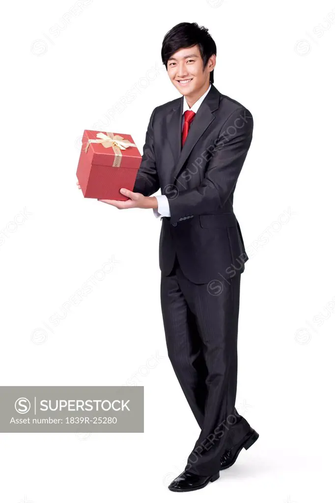 Happy Businessman Holding a Gift