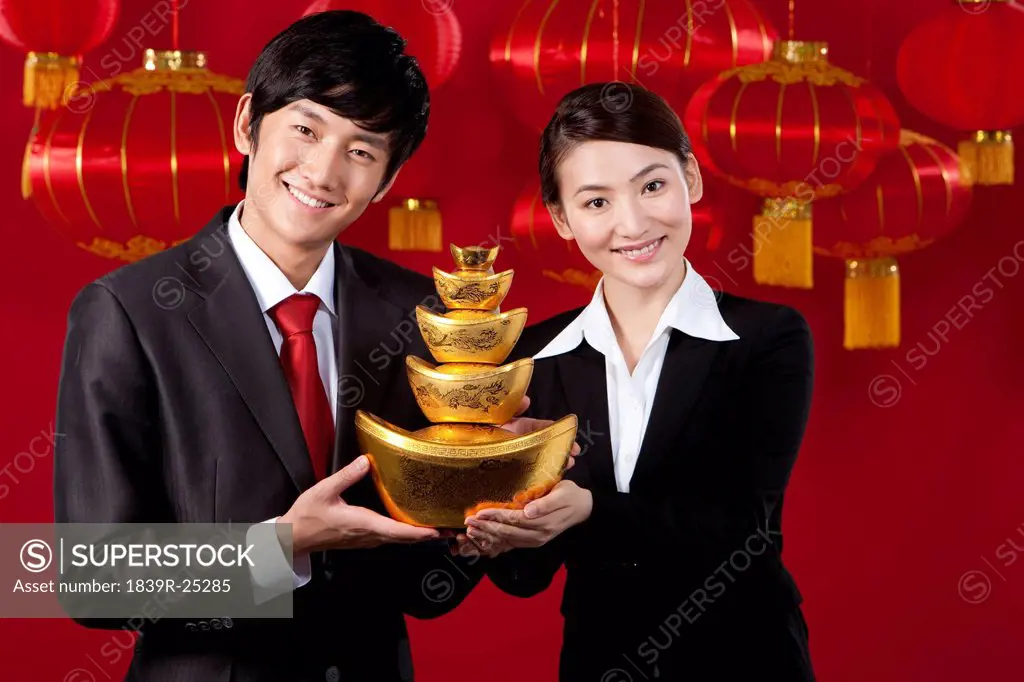 Businessmen Holding Chinese Gold Yuanbao