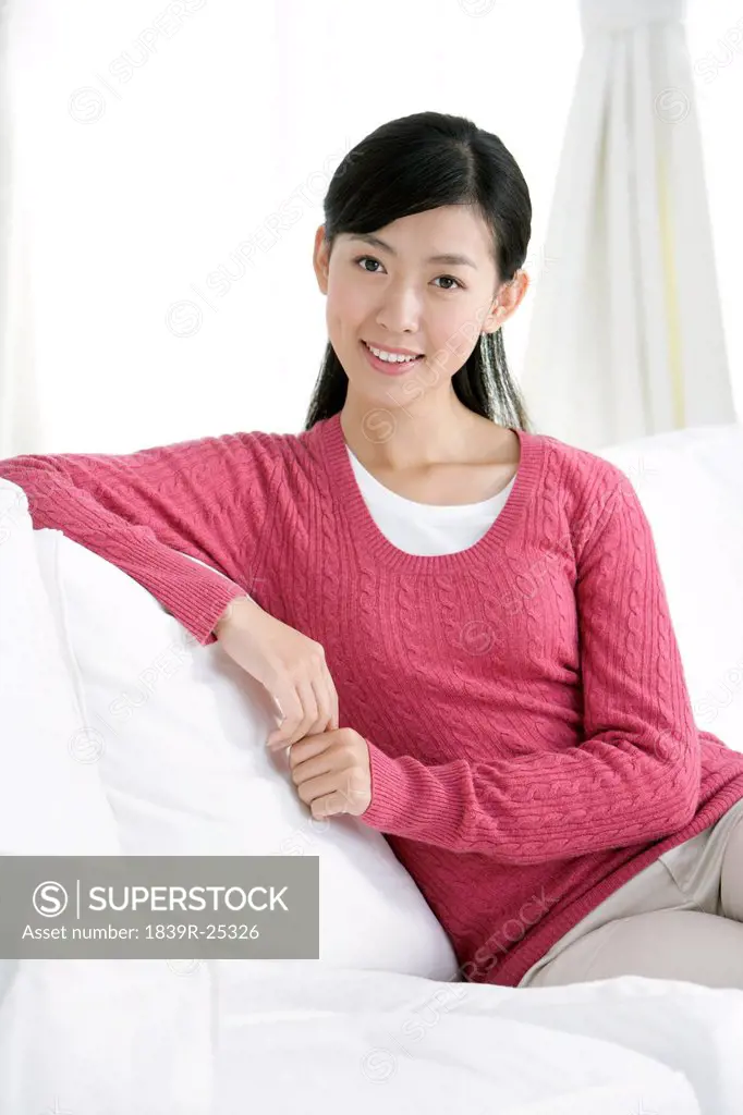 Young Chinese woman in a living room
