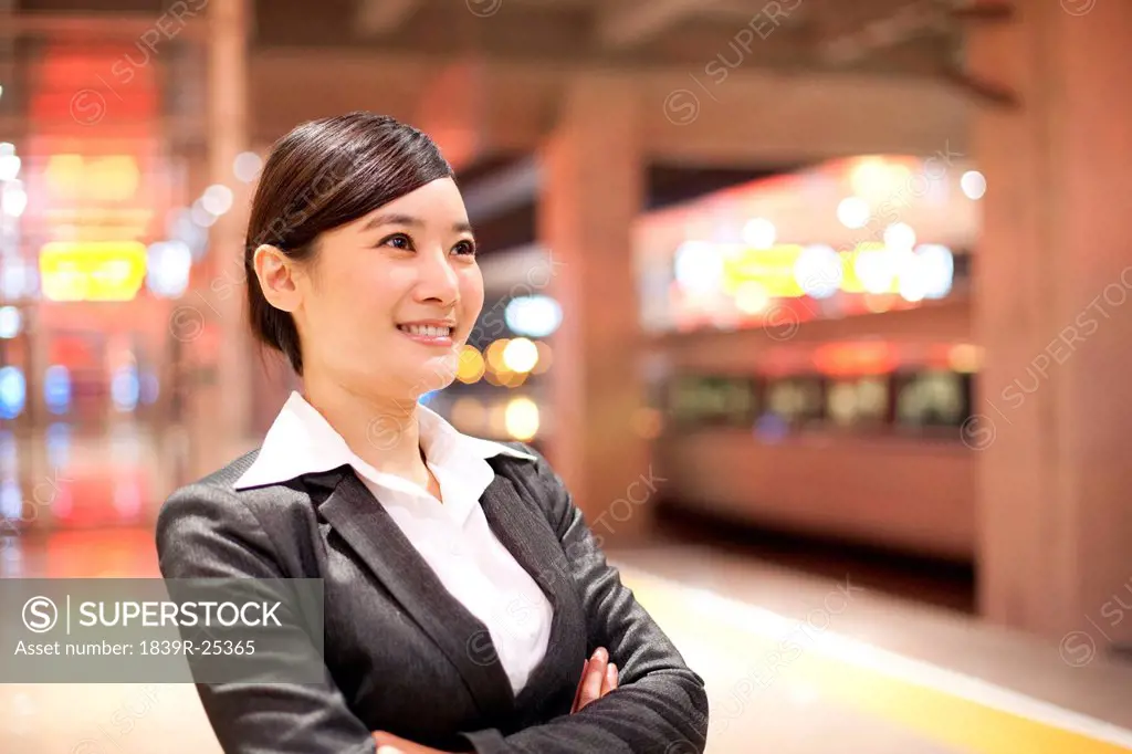 Young businesswoman contemplating at the train station