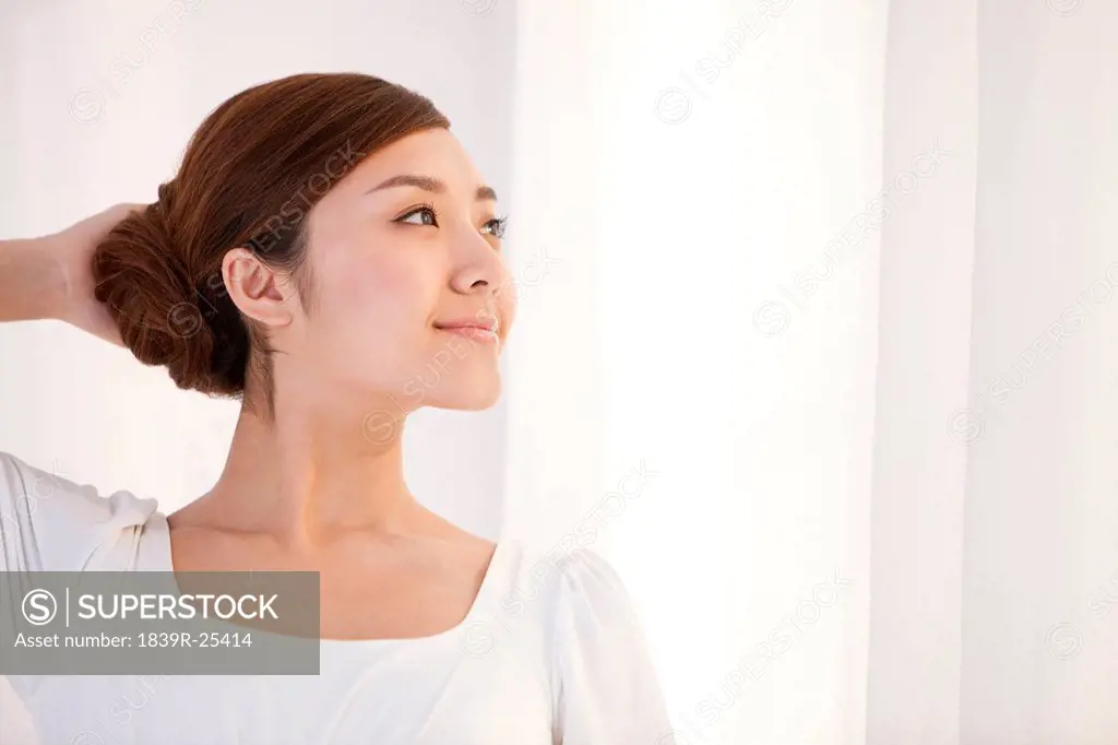Young woman smiling and looking to the distance