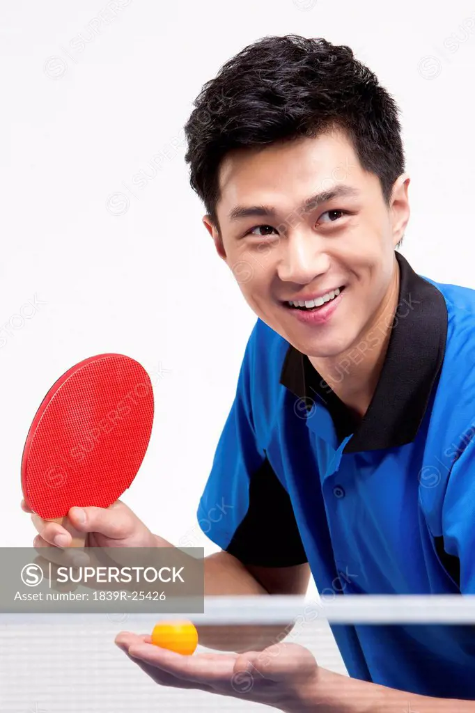 Table tennis player ready to serve