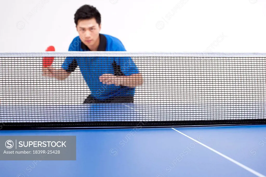 Table tennis player looking determined