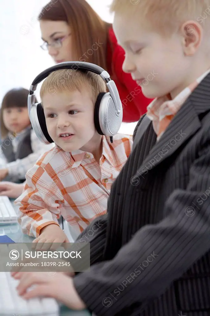 Young Boys Sitting At Computer