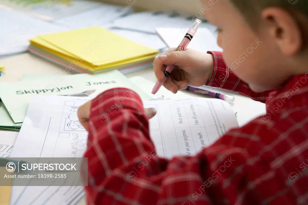 Small Boy Learning To Write