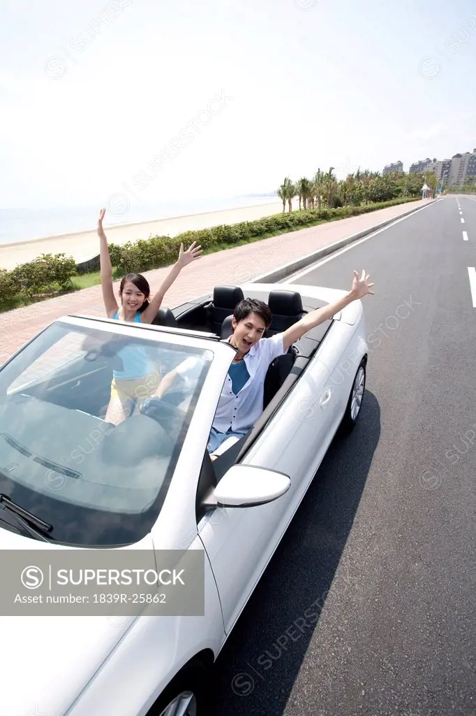 Young People Having Fun in a Convertible