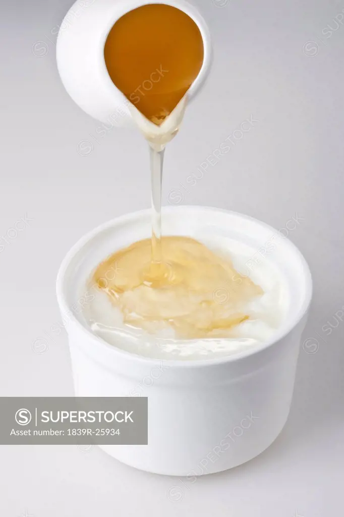 Honey Poured Into Yogurt