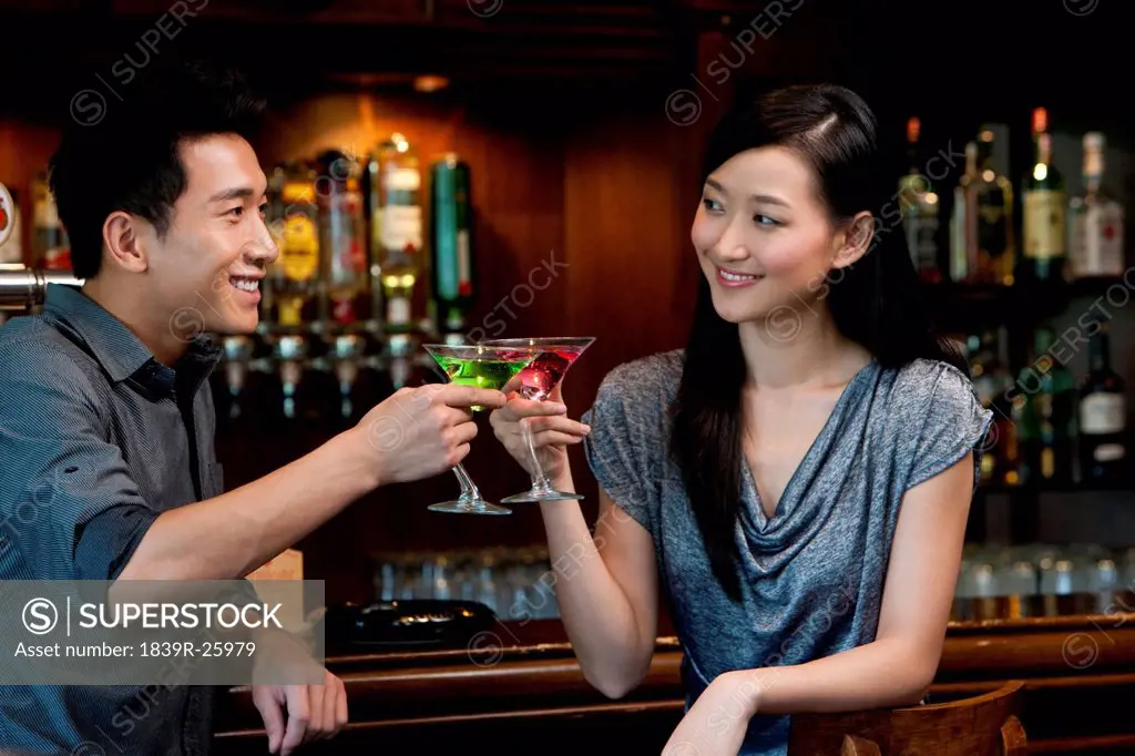 Couple Enjoying Cocktails Together