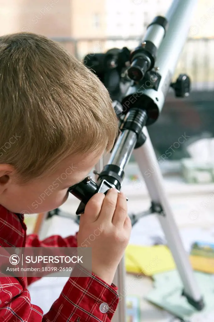 Boy Looking Through Telescope