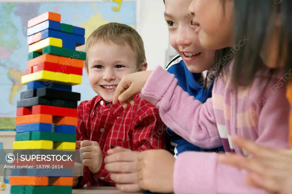Children And Tower Of Blocks