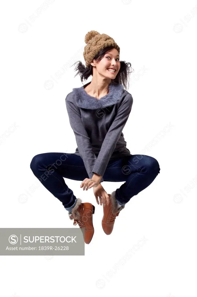 Young woman jumping in mid_air
