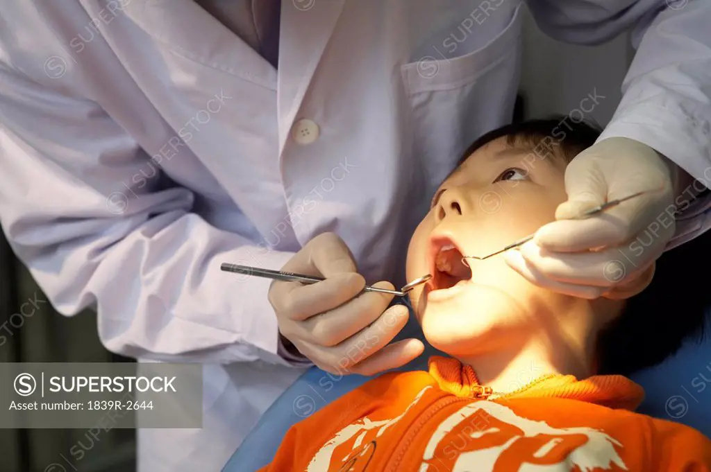 Dentist Examining Boy´s Teeth