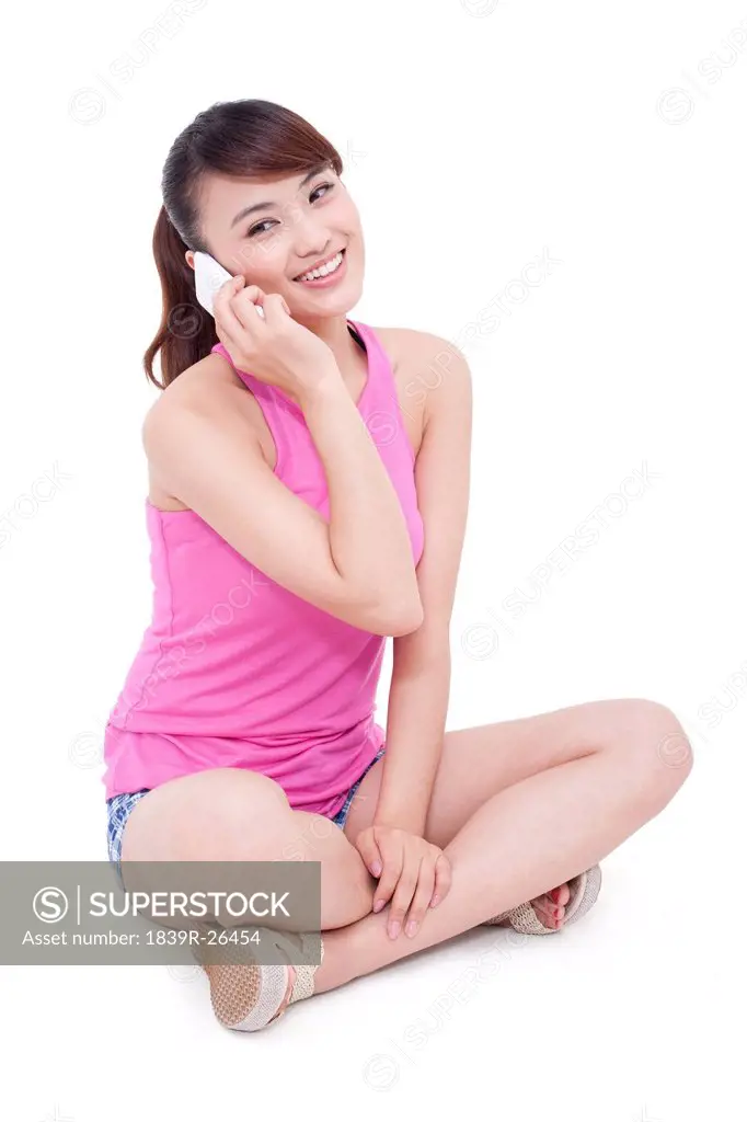 Happy young woman on the phone