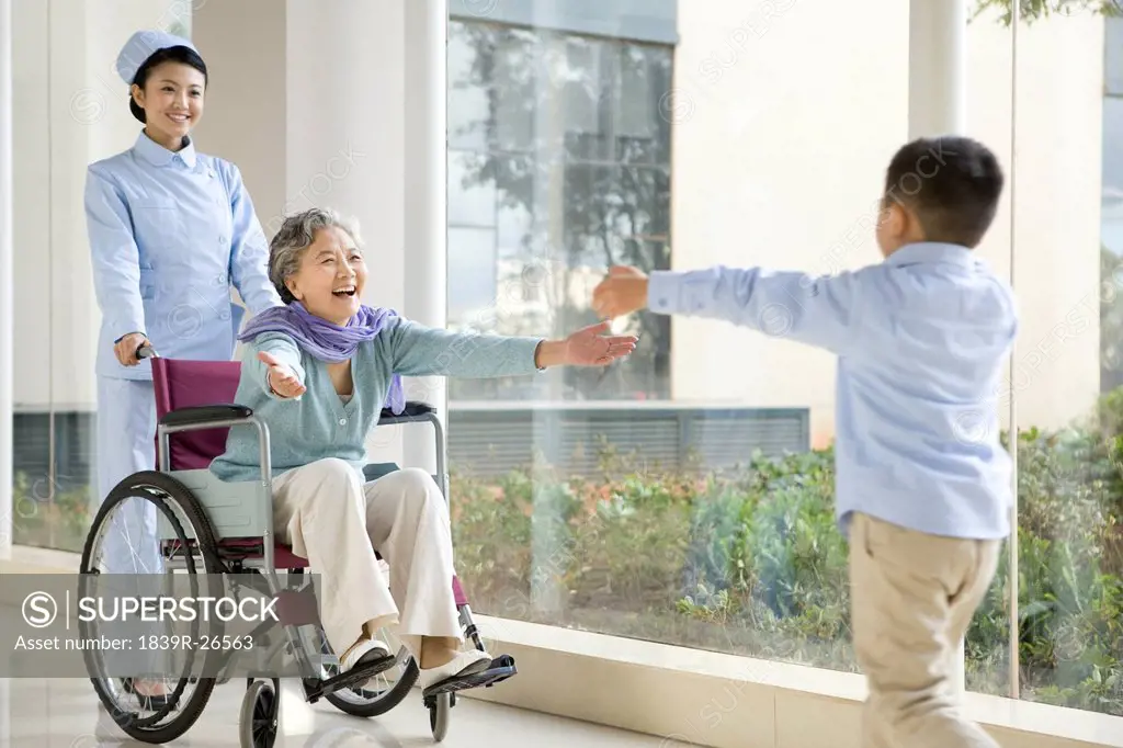 Grandson Runs to Embrace Grandmother in Wheelchair