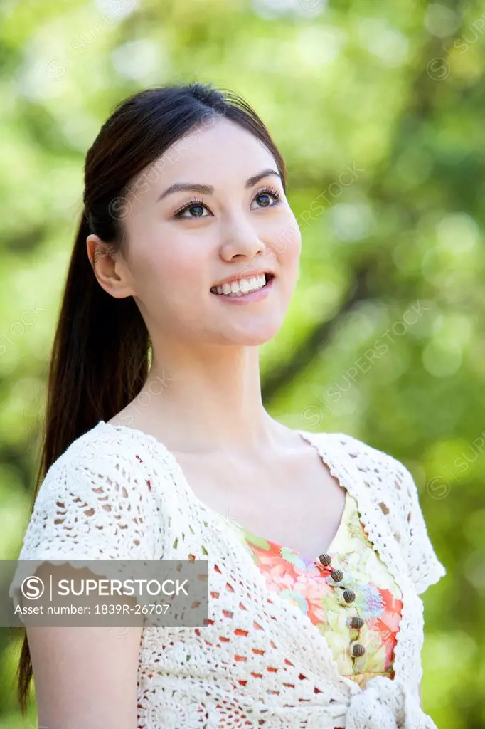Happy Young Woman at the Park