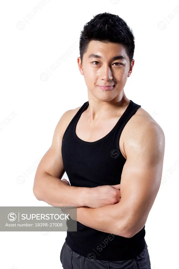 Muscular man with arms crossed