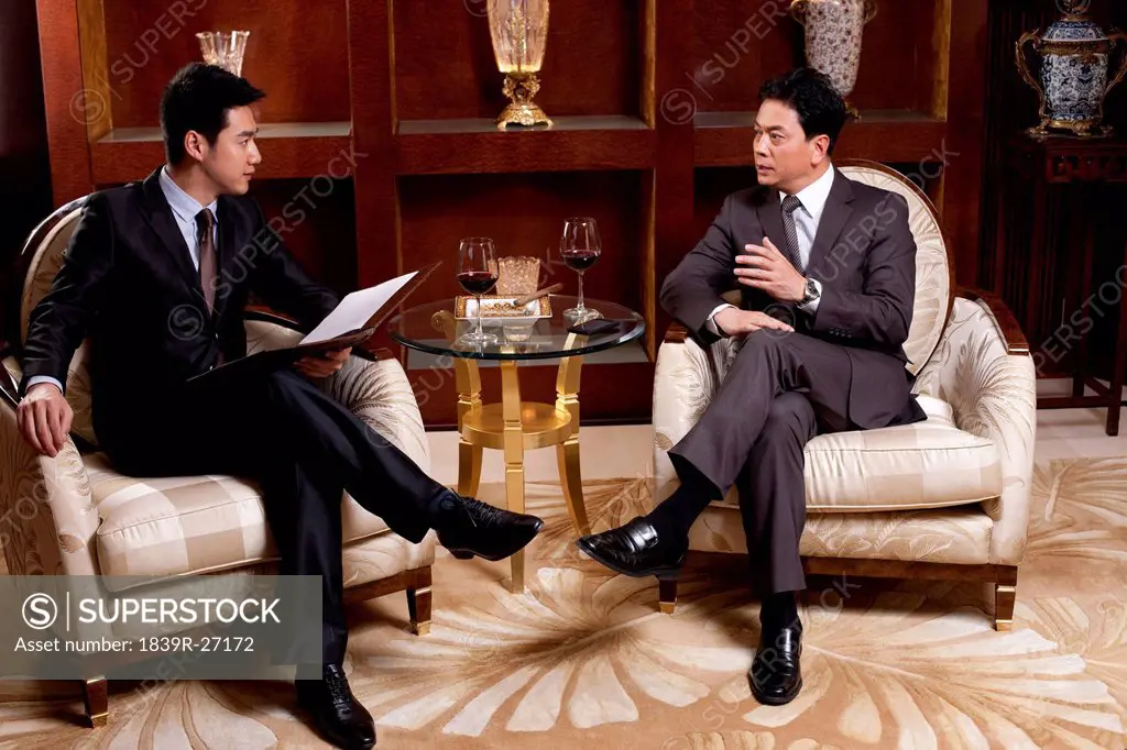 Businessmen in a meeting in a luxurious room