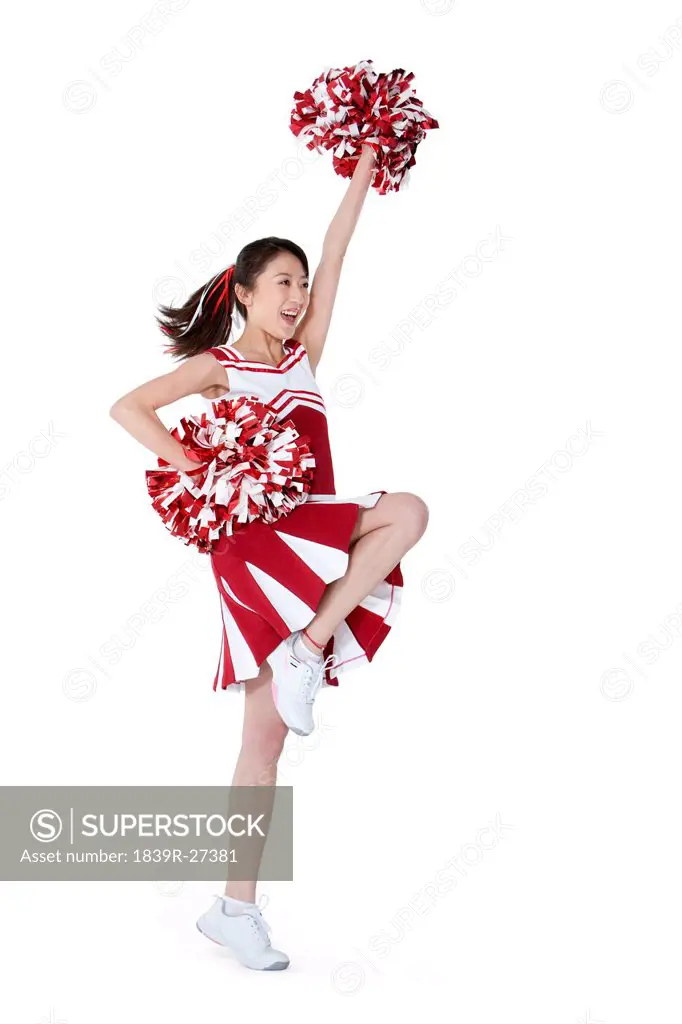 Cheerleader in action with her pom_poms
