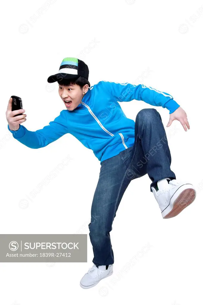 Excited man looking at his phone