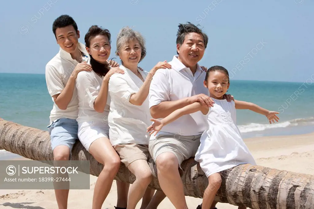 Happy Family Posing at the Beach