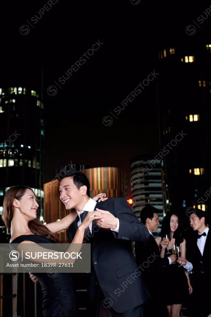 Couple Dancing at an Outdoor Party