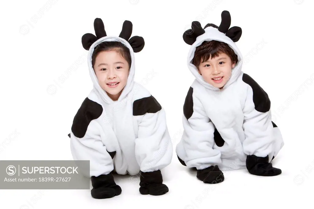 Children in cow costumes playing around